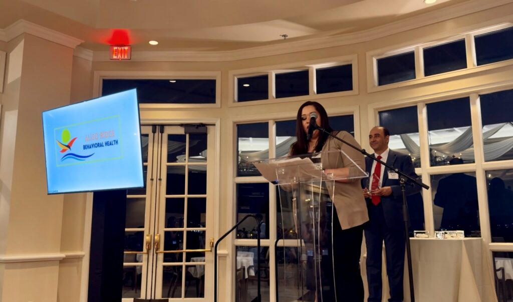 Clarissa Padilla, Chief Nursing Officer at Aliso Ridge Behavioral Health, accepting the Hiring Partner of the Year Award
